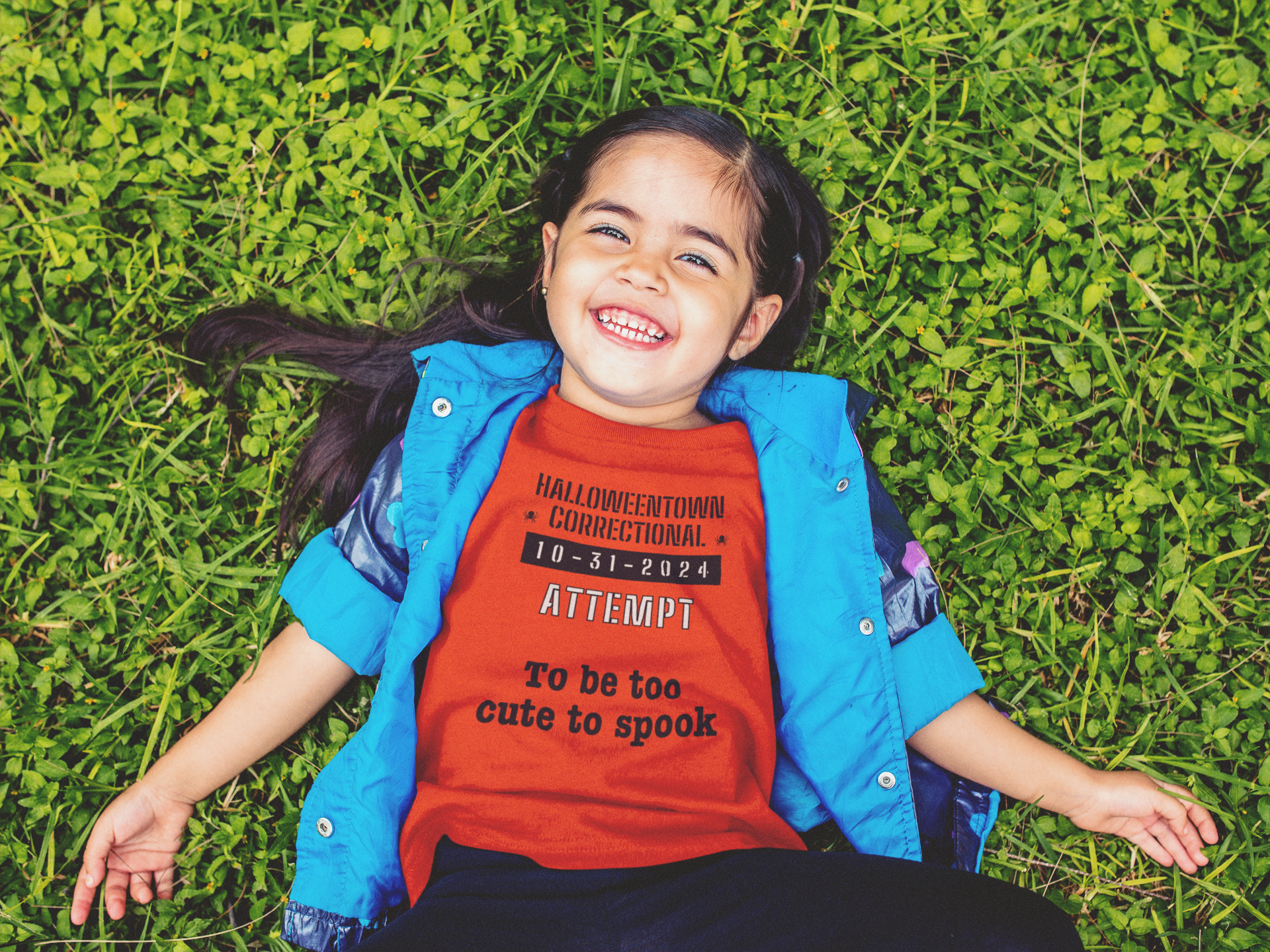 girls outside wearing a tee shirt that says HalloweenTown Correctional attempt to be too cute to spook family costume