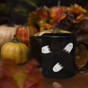 black halloween mug with flying white ghosts