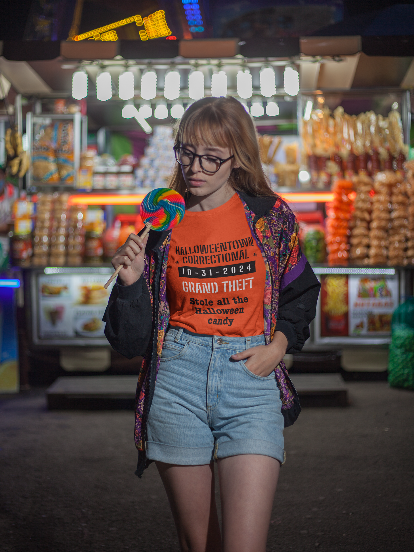 woman eating candy wearing a shirt halloweentown correctional grand theft stole all the halloween candy