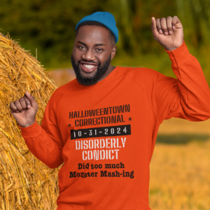 man dancing while wearing a shirt that says halloweentown correctional disorderly conduct did too much monster mashing