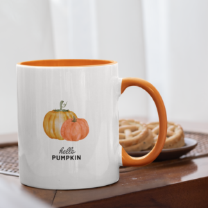 white mug with orange inside and handle that features two small painted-looking pumpkins and says hello pumpkin