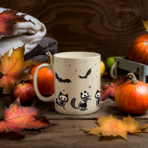 tan mug with skeleton kittens chasing bats fall halloween