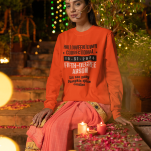 woman wearing a long sleeve orange shirt that says halloweentown correctional lit too many pumpkin spice candles family costume