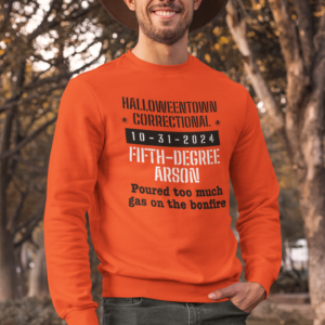 man outside in nature wearing a long sleeved tee family halloween costume arson poured too much gas on bonfire