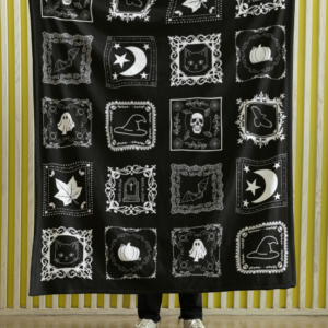 black and white quilt looking plush blanket with spooky halloween squares