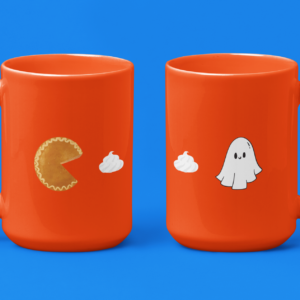pie that looks like pacman chasing whip cream and a ghost around a cute fall halloween mug