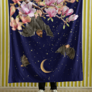 plush blanket featuring pink flowers and fruit bats flying past a crescent moon