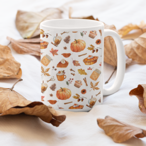 pumpkin spice mug that's white with images of pumpkins etc in a repeating pattern